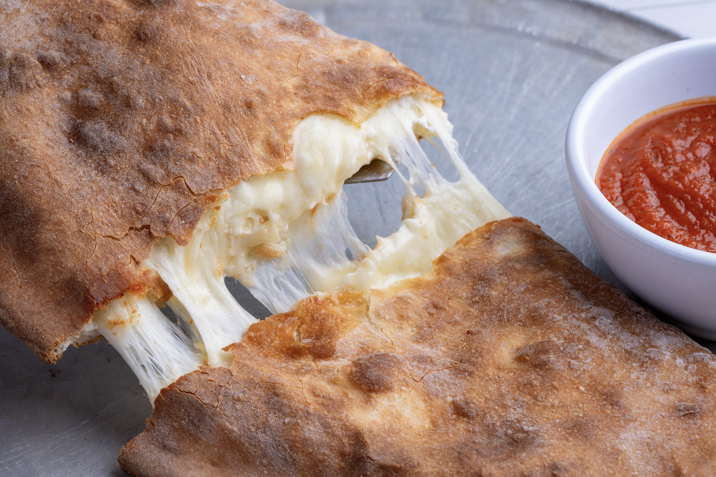 Sami's calzone — oven-baked with molten mozzarella