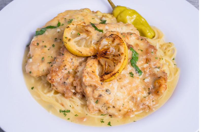 Chicken in lemon butter sauce over pasta at Sami's on Marco Island